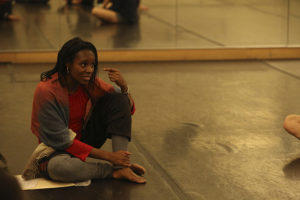 Sheron Wray seated in a dance studio teaching