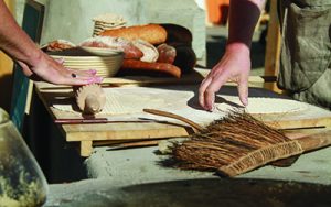 image of hands processing flatbread