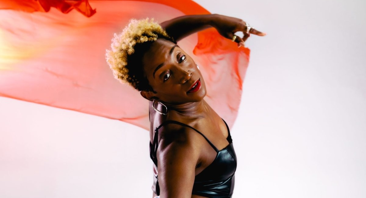 photo of dancer LaTasha Barnes with  a transparent scarf