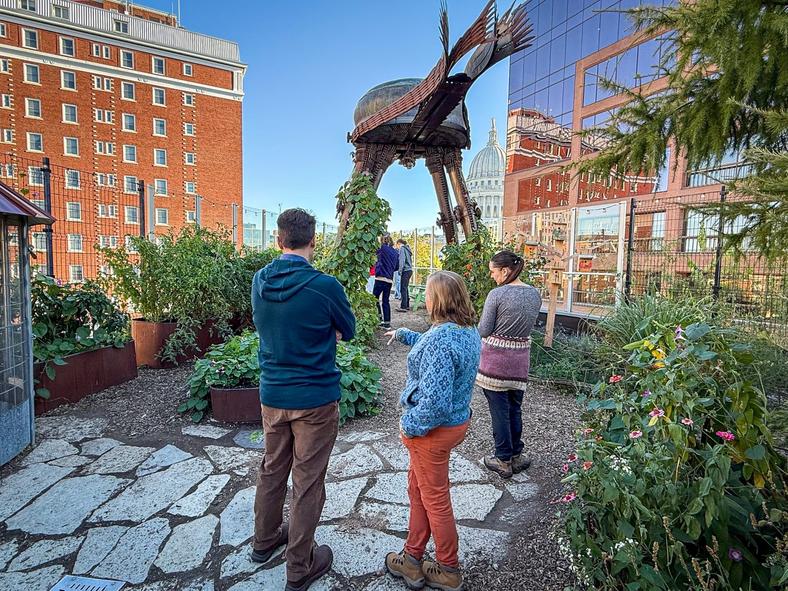 Nathan Larson (left) and Cheryl DeWelt (right) with LA 373 students at the Madison Children Community’s rooftop garden.