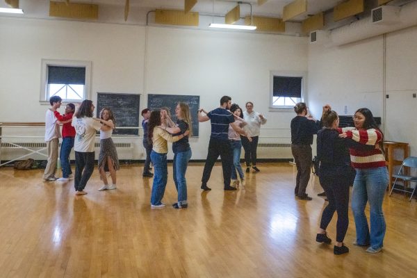 classroom of students partner dancing
