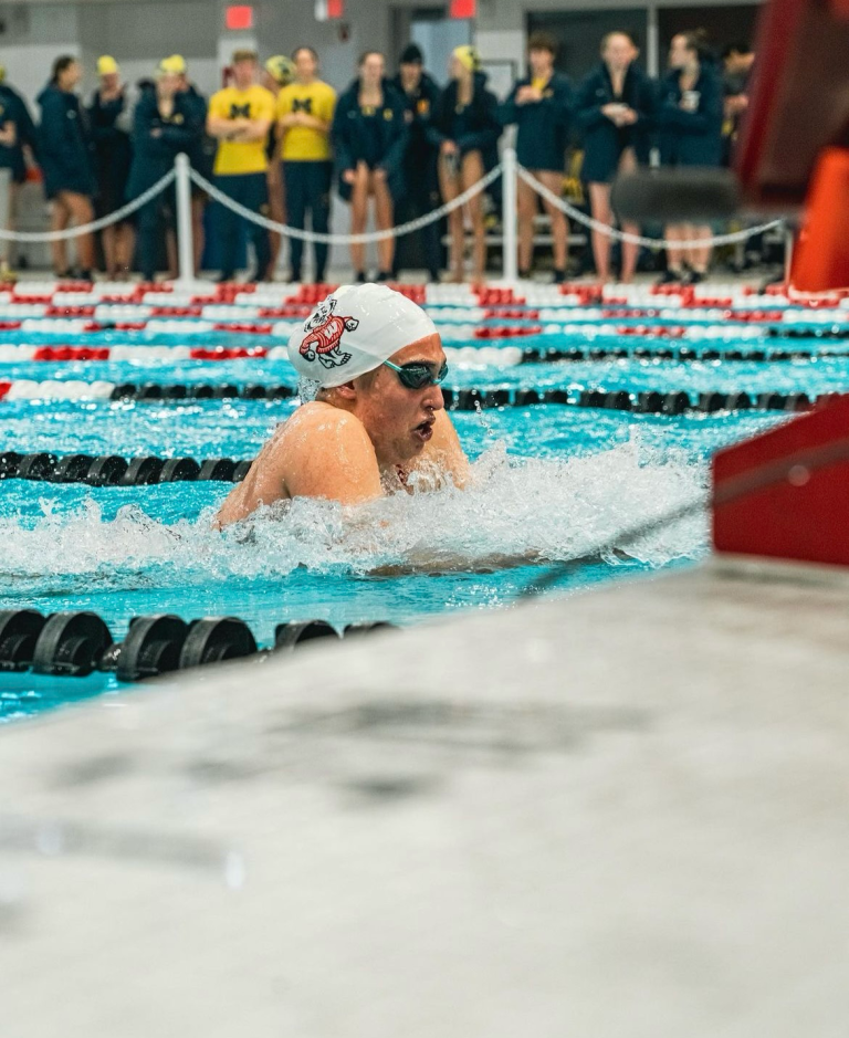 Natalie competing in the 100-meter breaststroke for the UW-Madison Women’s Swimming team. Photograph taken by Suvir Grover.