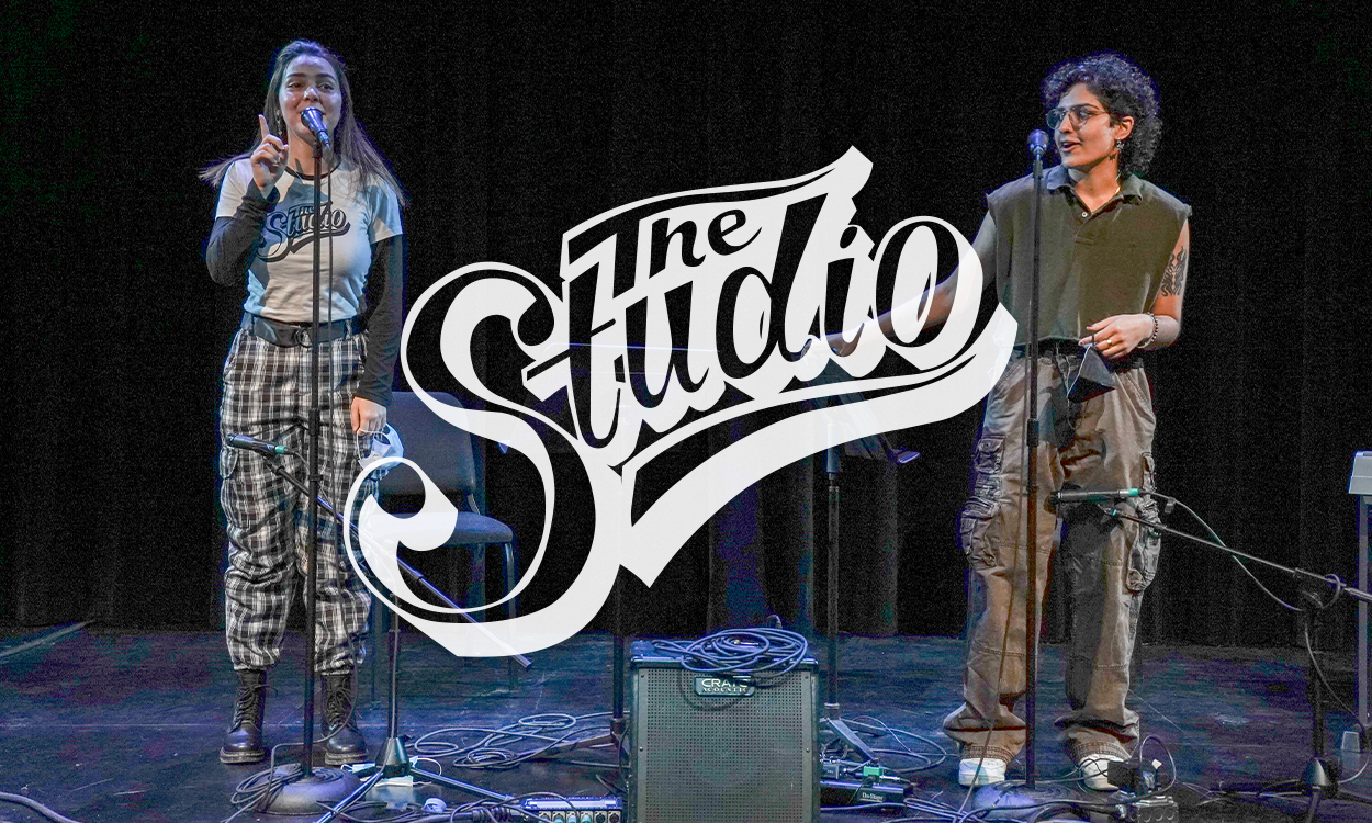a photo of two students performing vocals on a stage with The Studio logo layered on top